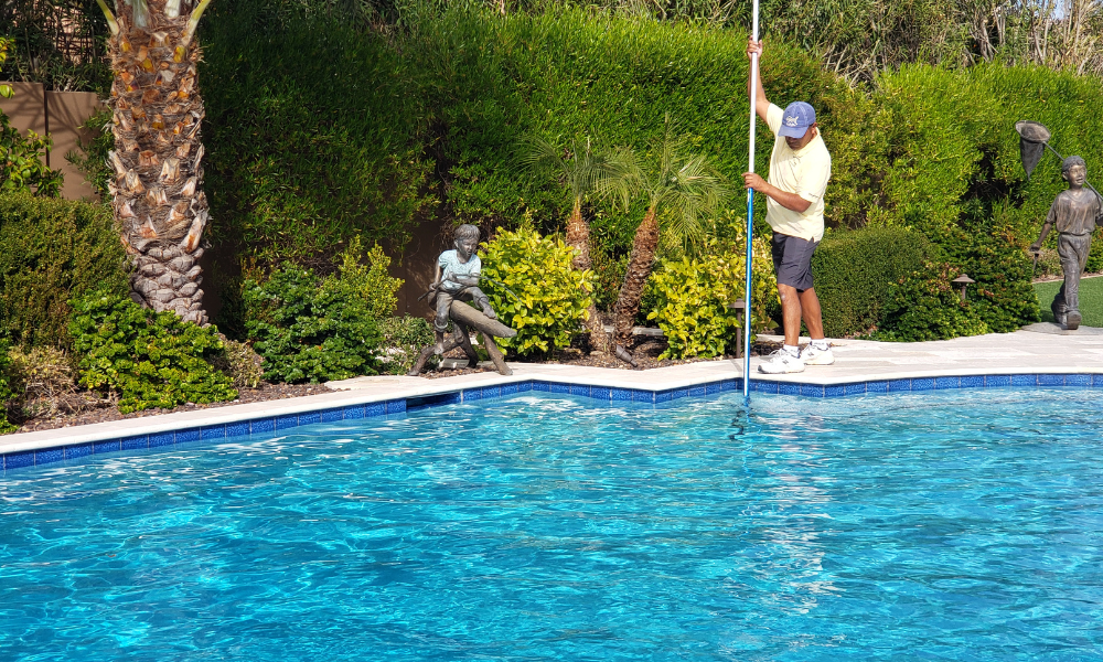 Blue Water crew cleaning a swimming pool