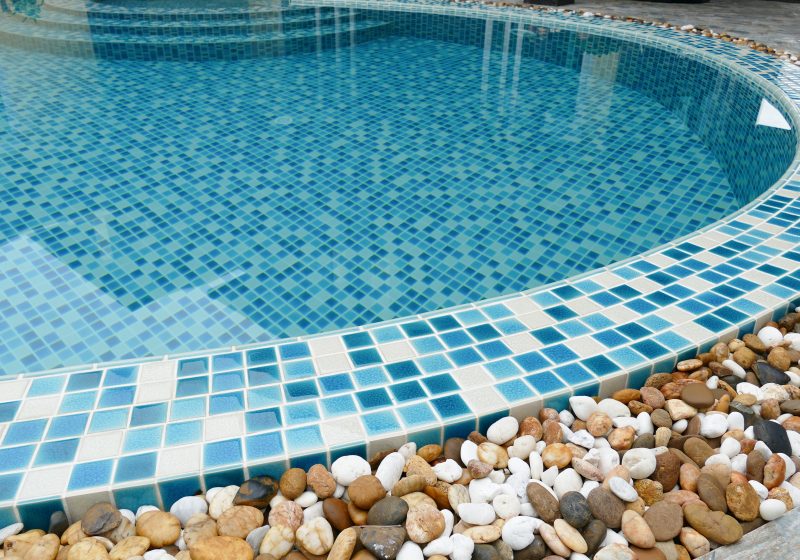 small stone decorating on the edge of the swimming pool